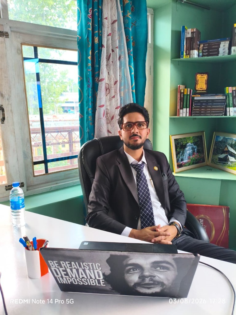 Zahoor Bhat at the Handwara office desk, ready to meet clients.
