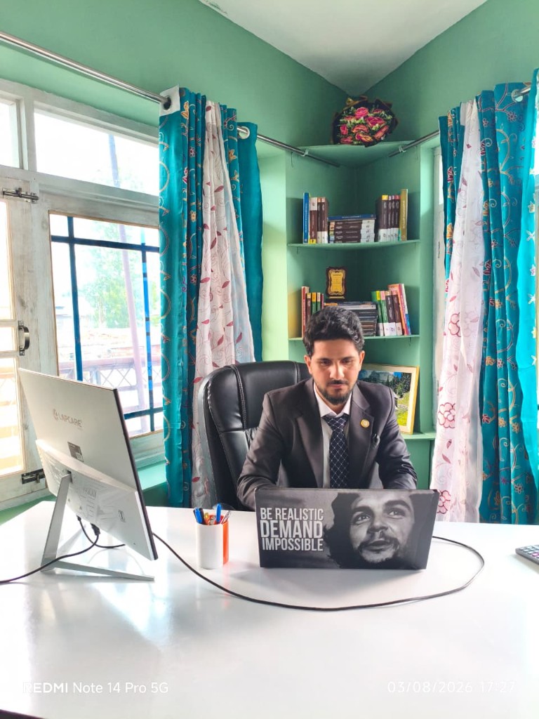 Working at the firm office with desk, bookshelves and natural light.